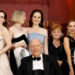 Raquel Cassidy, from back left, Sophie McShera, Laura Carmichael, Michelle Dockery, Lesley Nicol, Joanne Froggatt, Phyllis Logan and writer Julian Fellowes, front, pose for photographers upon arrival at the world premiere of the film 'Downton Abbey: The Grand Finale' on Wednesday, Sept. 3, 2025, in London. (Photo by Millie Turner/Invision/AP)
