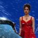 Still from Megadoc of a person in a red dress.