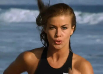 Lani McKenize jogging on the beach on Baywatch
