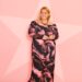 Charlotte Crosby from Celebs Go Dating, wearing an off-the-shoulder black and pink patterned dress.