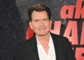 Charlie Sheen poses at the premiere of his documentary.