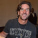 Brett James holding a guitar