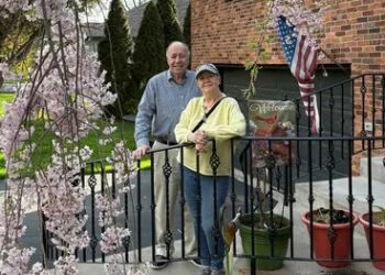 Jerry Castiglione Jerry and Marie Castiglione smiling in front of their house