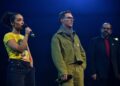 Ruth Negga, Benedict Cumberbatch and Amer Hlehel speak onstage during the Together For Palestine concert.