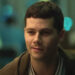 Dylan O'Brien sitting in a diner in Twinless.