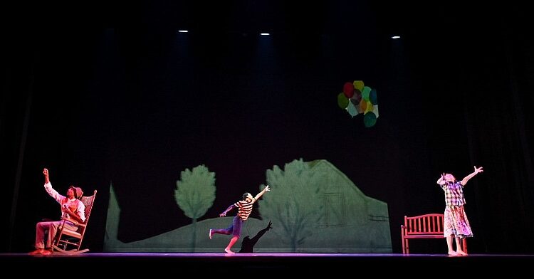 “The Remember Balloons,” based on the award-winning children’s book by Jessie Oliveros, uses contemporary choreography, an original score and digital projections to tell the story of a child and his grandfather facing Alzheimer’s, onstage Wednesday at Fayetteville’s Walton Arts Center.
(Special to the Democrat-Gazette/Shane Wynn)