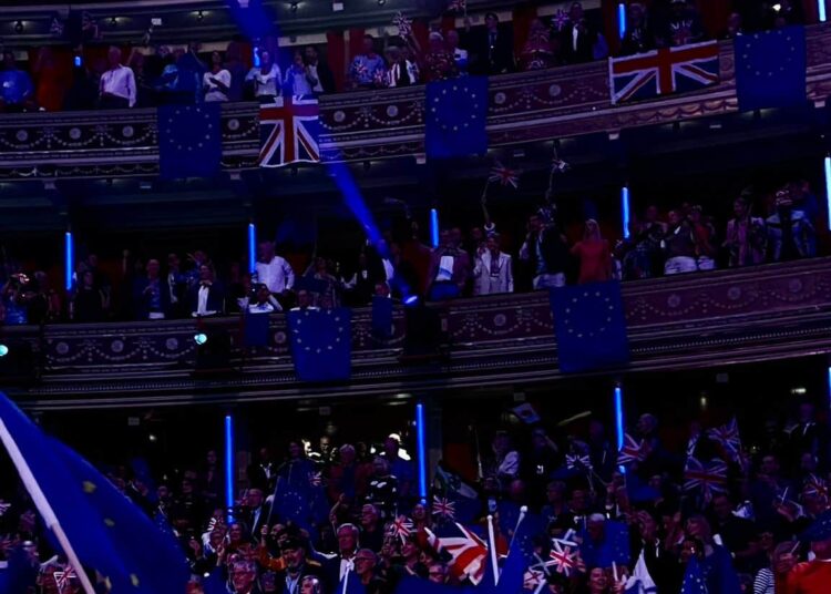 Concertgoers waving EU flags at the Royal Albert Hall.