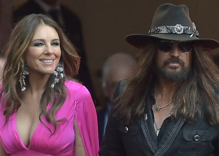 Elizabeth Hurley and Billy Ray Cyrus Ready to Mix Business With Pleasure, ‘Capitalize’ on Romance – Globe Magazine