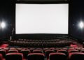 Empty movie theater and blank screen (theatre, motion pictures, cinema).