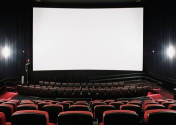 Empty movie theater and blank screen (theatre, motion pictures, cinema).