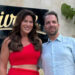 Emily Simpson and Shane Simpson smiling together outdoors.