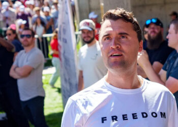 Charlie Kirk looks into the crowd at a Utah event.