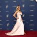 Kit Hoover wears a white satin gown.