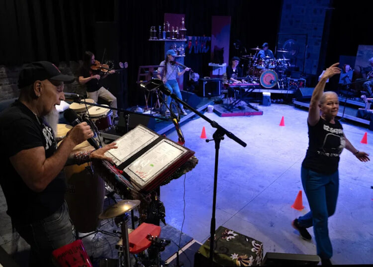 Umberto Crenca recites poetry as the band plays and dancer Heather Ahern glides by in rehearsals for "From Here to Where," which will open Wilbury Theatre Group's season in Providence on Sept. 18.