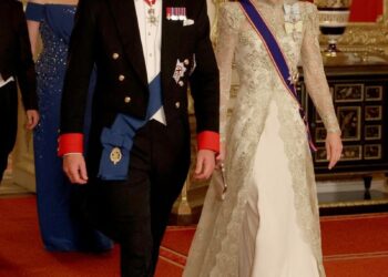 Britain's William, Prince of Wales and Catherine, Princess of Wales walk to attend the State Banquet at Windsor Castle during the State visit by the President of the United States of America