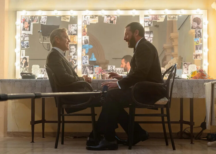 Peter Mountain/Netflix - PHOTO: Adam Sandler and George Clooney in a scene from "Jay Kelly."
