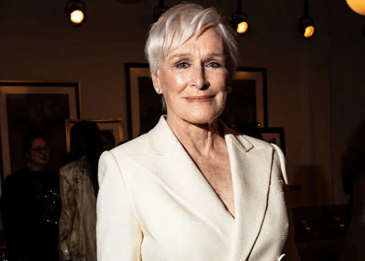 Glenn Close in a white suit at the Ralph Lauren fashion show in April 2024