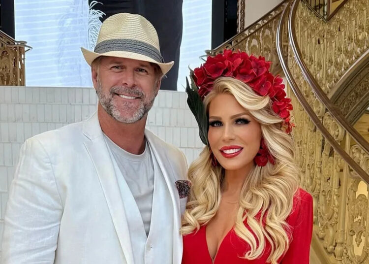 Gretchen Rossi and, partner, Slade Smiley posing together.