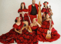 ¡Viva el Arte de Santa Bárbara! performers in red and black costumes gather for a group photo. (Courtesy photo)