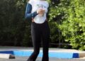 Hailey Bieber styled a cropped racing shirt with flared yoga pants