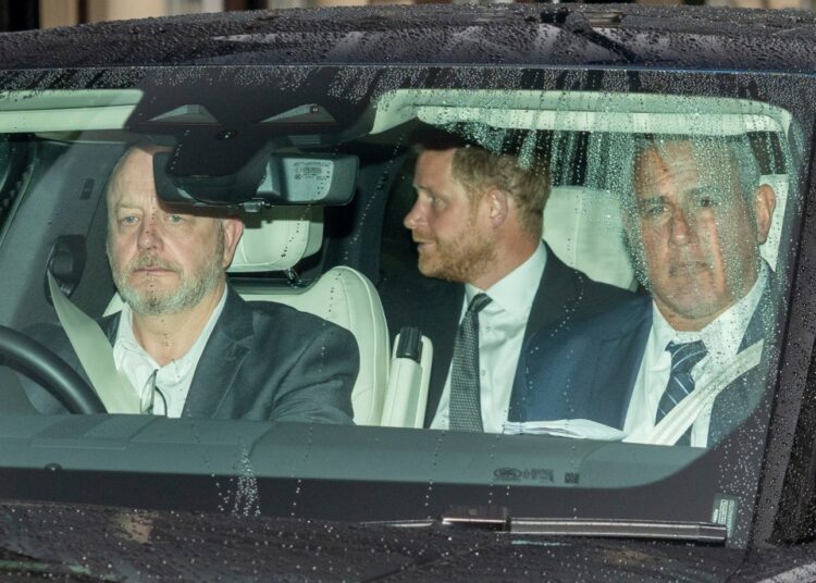Prince Harry leaving Clarence House in a car.
