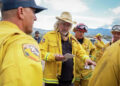 Filmmaker Paul Greengrass, center, during the filming of "The Lost Bus." His goal was to make escaping the 2018 Camp Fire an immersive experience. (Melinda Sue Gordon/Associated Press)