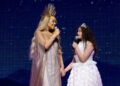 Mariah Carey and daughter Monroe Cannon performing together on stage at Christmas concert, 2023