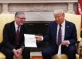 The president was hand delivered an invitation to visit the UK from the King by Sir Keir Starmer in February (Carl Court/PA)