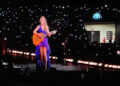 Taylor Swift wore a new blue and purple dress during her surprise, acoustic set during her Eras Tour concert at Hard Rock Stadium in Miami on Saturday, Oct. 19, 2024.