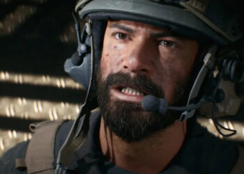 Battlefield 6 beta week 2: A close-up shot of masculine soldier wearing a helmet looking up and gritting his teeth.