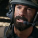 Battlefield 6 beta week 2: A close-up shot of masculine soldier wearing a helmet looking up and gritting his teeth.