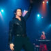 Hugh Jackman on stage with his hair blowing as a Neil Diamond impersonator in Song Sung Blue