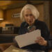 Helen Mirren looking at a clue in The Thursday Murder Club. .
