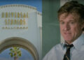 Universal Studios Hollywood entrance arch/Robert Redford smiling in Sneakers.