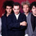 Guitarist Porl Thompson, bass player Simon Gallup, musician, songwriter and lead singer Robert Smith, drummer Boris Williams and keyboard player Laurence 'Lol' Tolhurst, all members of the English rock band The Cure.