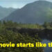 Animated landscape with lush forest, mountains, a lake, and a castle on a cliff