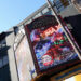 A large IMAX theater marquee displays a