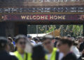 People enter the DreamVille camping site, at the Tomorrowland electronic music festival on July 17, 2025, in Boom.