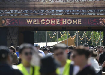 People enter the DreamVille camping site, at the Tomorrowland electronic music festival on July 17, 2025, in Boom.