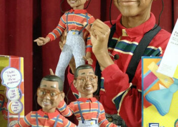 Jaleel White, in character as Steve Urkell, shows off his doll counterpart during the 1991 heyday of