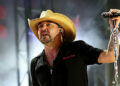 Jason Aldean holding microphone during 2025 CMA Fest