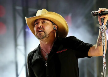 Jason Aldean holding microphone during 2025 CMA Fest