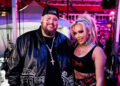 Jelly Roll wears black hat and jacket with wife Bunnie Xo in a crop top