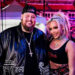 Jelly Roll wears black hat and jacket with wife Bunnie Xo in a crop top