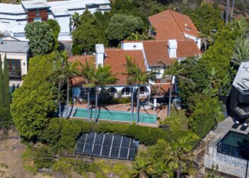 The estate sprawls across nearly 5,000 square feet with four spacious bedrooms and five bathrooms.