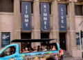 A tour bus drives past the Jimmy Kimmel Theater a day after ABC has pulled the late-night host off air.