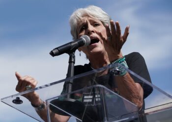 Joan Baez, seen here protesting Brett Kavanaugh's nomination to the U.S. Supreme Court in 2018.