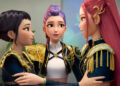 Zoey, Rumi and Mira embracing with black and gold costumes on in KPop Demon Hunters.