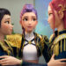 Zoey, Rumi and Mira embracing with black and gold costumes on in KPop Demon Hunters.
