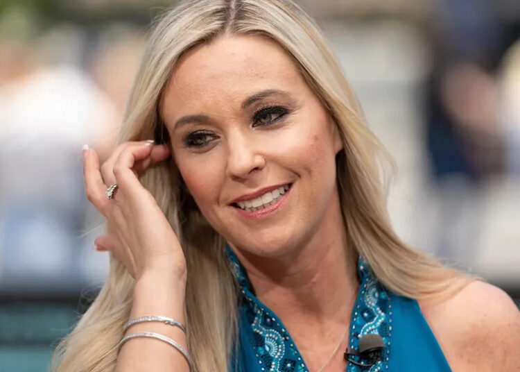 Kate Gosselin touching her hair